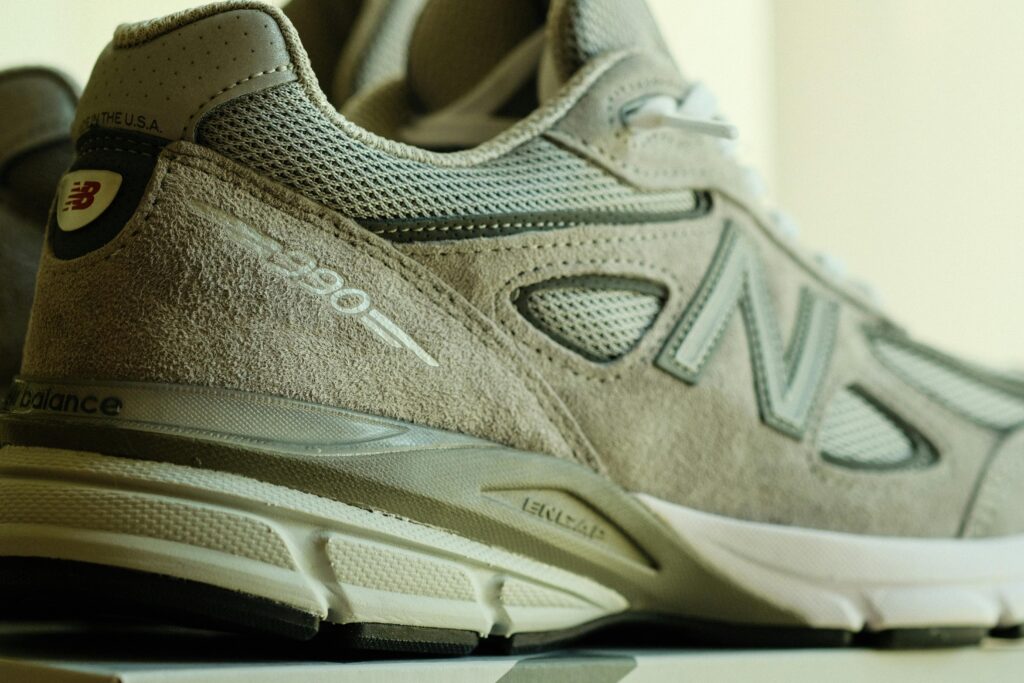 Detailed close-up of a gray athletic running shoe showing texture and design.