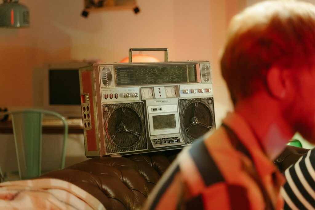 Classic vintage boombox in a cozy indoor setting capturing retro vibes with warm lighting.